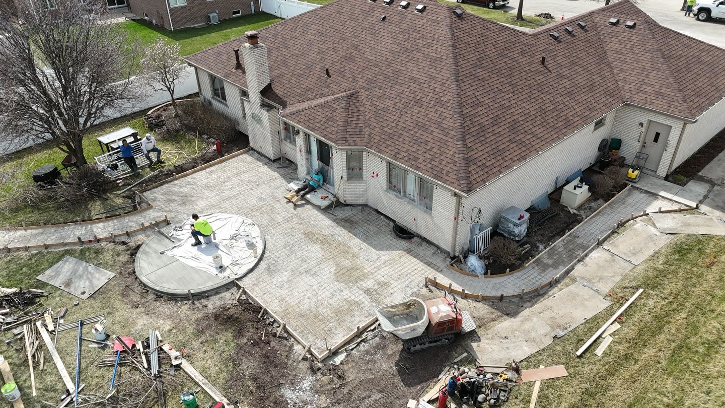 LGND crew finishing a circular patio with forms and steel mesh in place